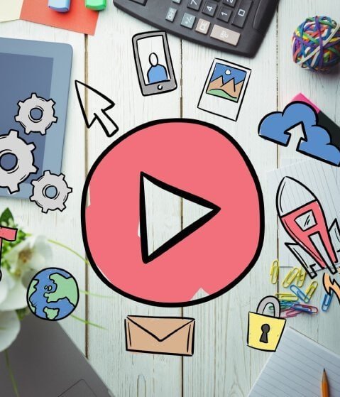 Digital marketing and social media icons with play button on desk.